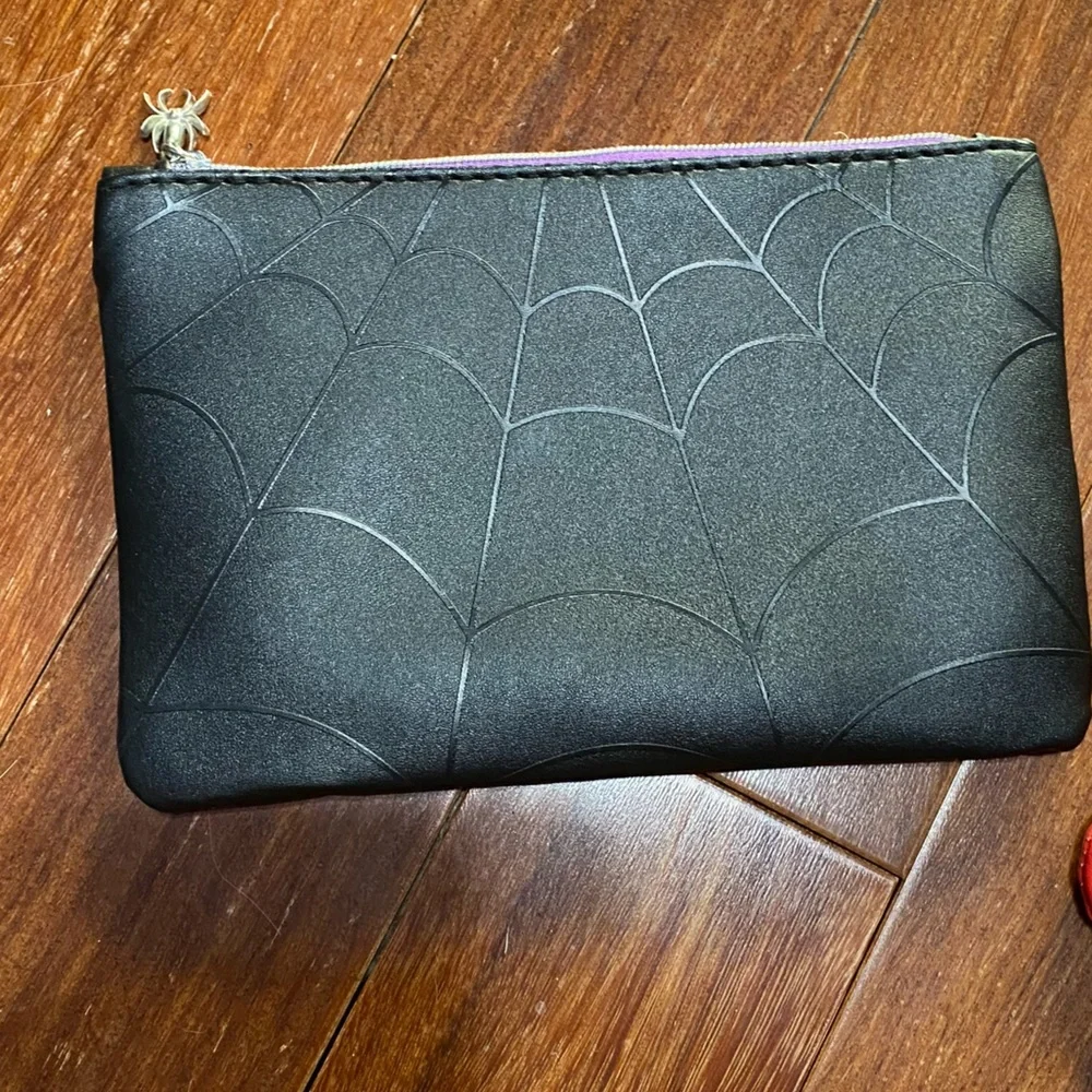 5 ipsy bags including spider web